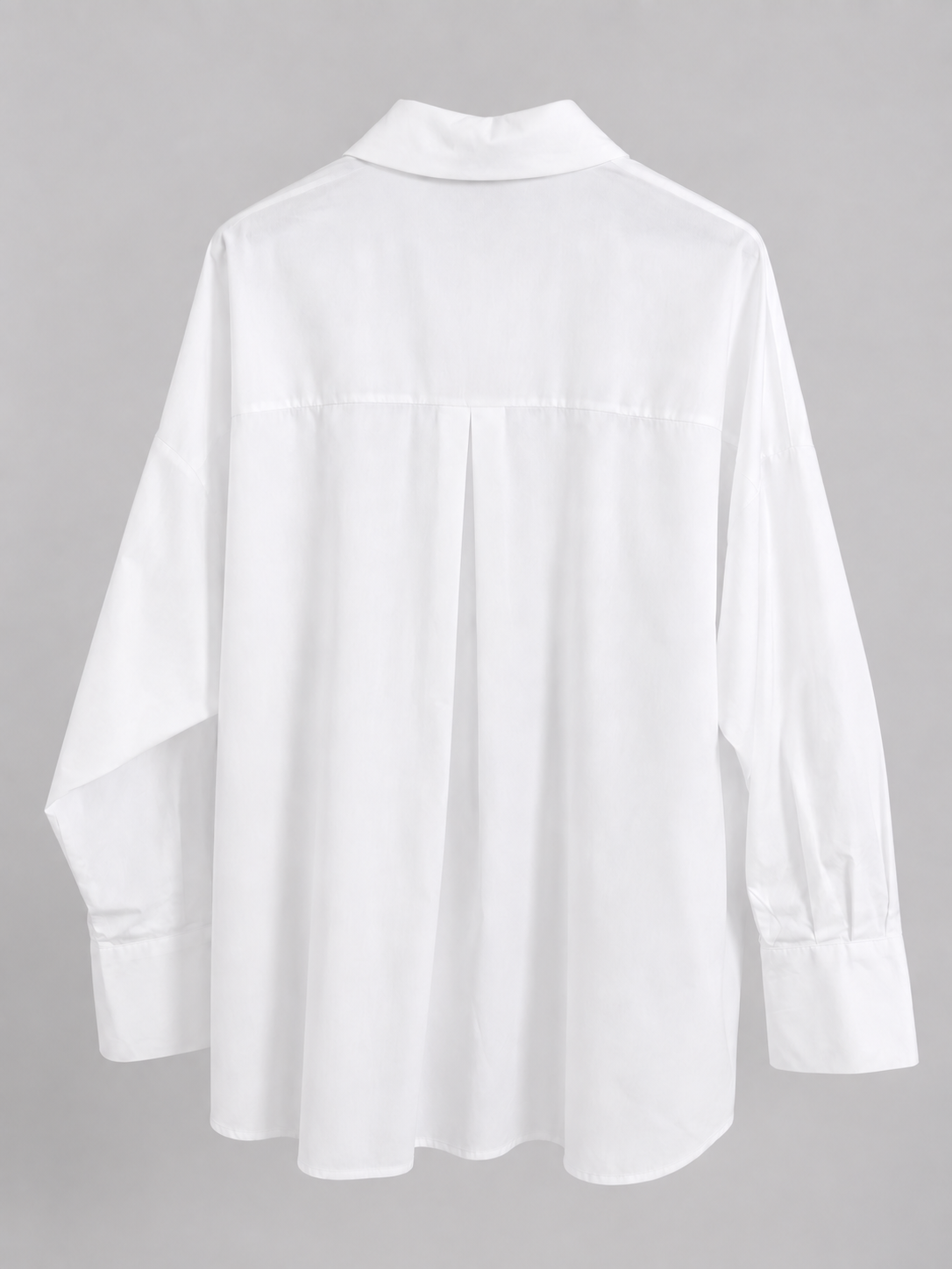 Weiße Oversize-Bluse mit rosa Strassverzierung